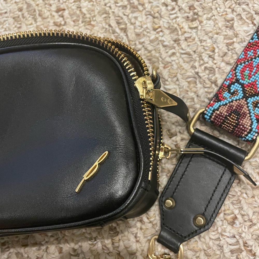 Black Brian Atwood crossbody with beaded guitar strap